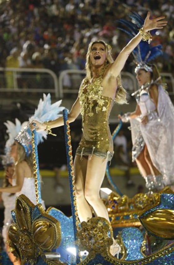 Brazilian top model Gisele Bundchen waves as she performs on a Vila Isabel samba school float during carnival celebrations March 7 at the Sambadrome in Rio de Janeiro, Brazil.